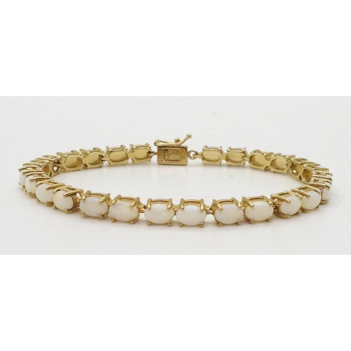 799 - A 9ct gold white opal bracelet, length 18.5cm, weight 11.6gms