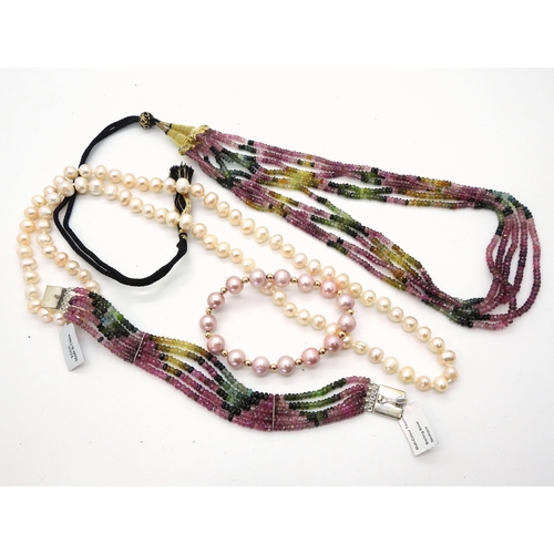 838 - A multi strand multi colour tourmaline bead necklace and matching bracelet, a long string of peach p... 