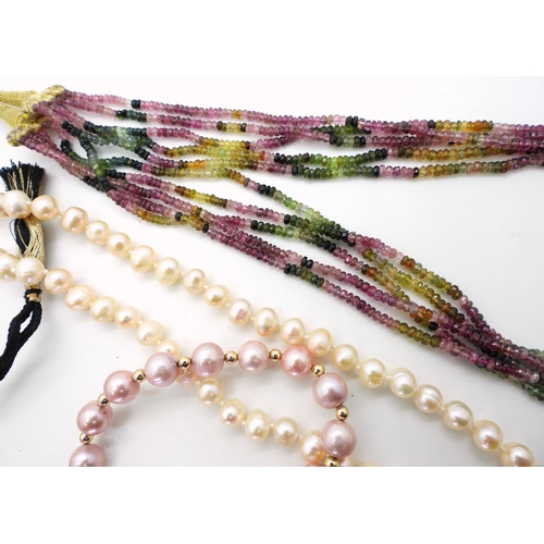 838 - A multi strand multi colour tourmaline bead necklace and matching bracelet, a long string of peach p... 