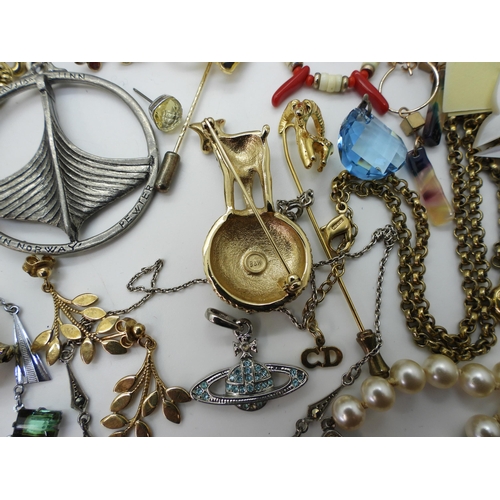 853 - A collection of vintage costume jewellery to include, a Butler & Wilson Lamb & Wool brooch, ... 