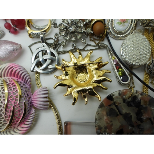 854 - A Vivienne Westwood necklace, Butler & Wilson sun brooch, items by Weiss, A&S, a Danish bang... 