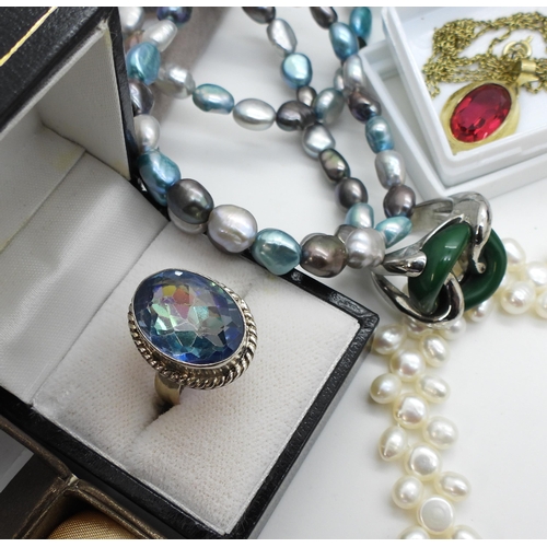 860 - A silver mermaid mystic topaz ring, a silver peridot ring, a collection of pearl necklaces to includ... 