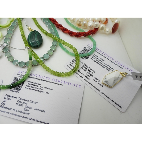 875 - A collection of The Jewellery Channel items, to include a graduated emerald bead necklace, a red tig... 