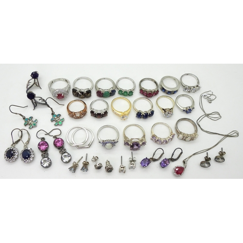 881 - A collection of silver and white metal rings and earrings set with gems and gemstones to include, bl... 