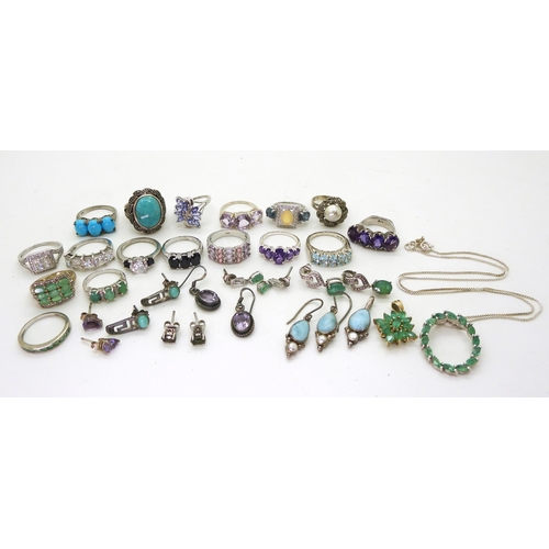 882 - A silver emerald pendant and chain, silver and white metal rings, earrings and pendants set with gem... 