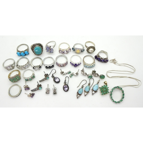 882 - A silver emerald pendant and chain, silver and white metal rings, earrings and pendants set with gem... 