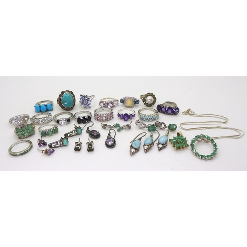 882 - A silver emerald pendant and chain, silver and white metal rings, earrings and pendants set with gem... 