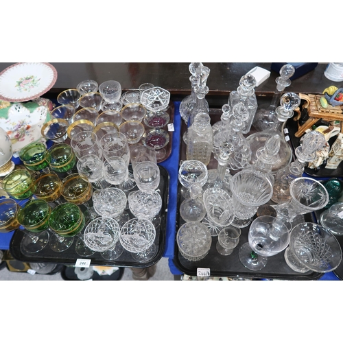 244 - A collection of gilt rimmed drinking glasses, etched glasses, others and assorted decanters etc