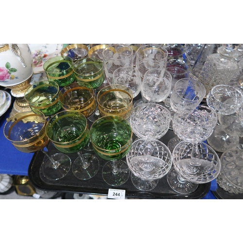 244 - A collection of gilt rimmed drinking glasses, etched glasses, others and assorted decanters etc