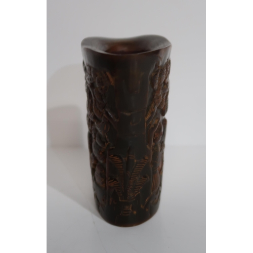 278A - A Chinese carved horn libation cup, depicting figures amongst pine trees, a carved model of Buddha, ... 