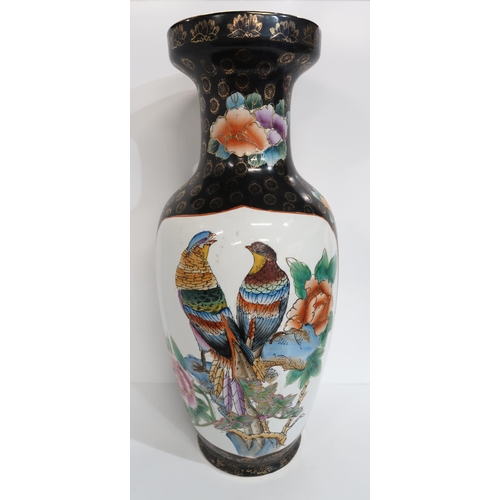 279 - A contemporary Chinese black ground vase, of baluster form, decorated with peacocks, 61cm high