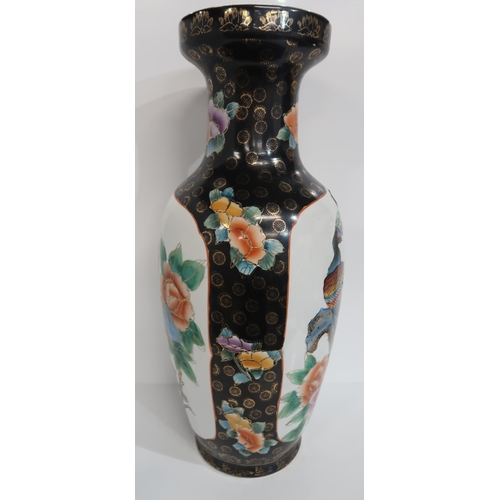 279 - A contemporary Chinese black ground vase, of baluster form, decorated with peacocks, 61cm high