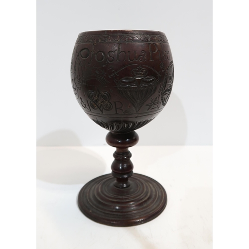 279A - An18th century carved coconut cup, inscribed Joshua Pike, 1780, carved with heart and star motifs, w... 