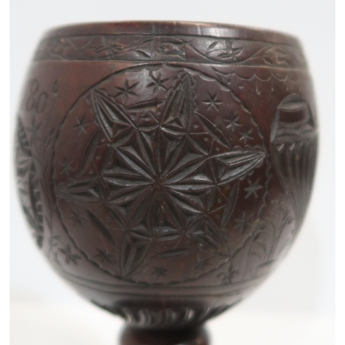 279A - An18th century carved coconut cup, inscribed Joshua Pike, 1780, carved with heart and star motifs, w... 