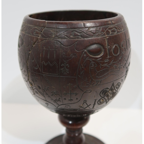 279A - An18th century carved coconut cup, inscribed Joshua Pike, 1780, carved with heart and star motifs, w... 