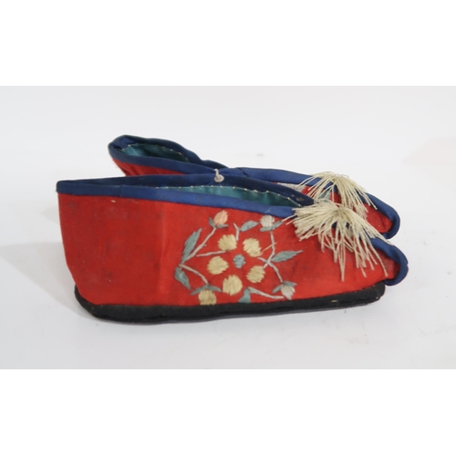 280 - Two pairs of Chinese embroidered silk lotus shoes, decorated with insects and birds