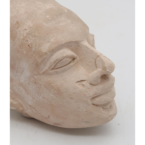 282 - An Egyptian Amarna style head, possibly depicting a child of Atkhenaten and Nefertiti, 14cm, and a t... 