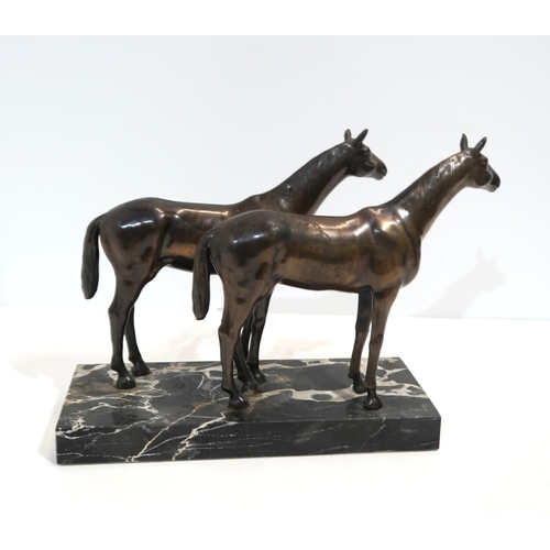 284A - A bronze equestrian group of a pair of horses, on a marble base, 17 x 20cm