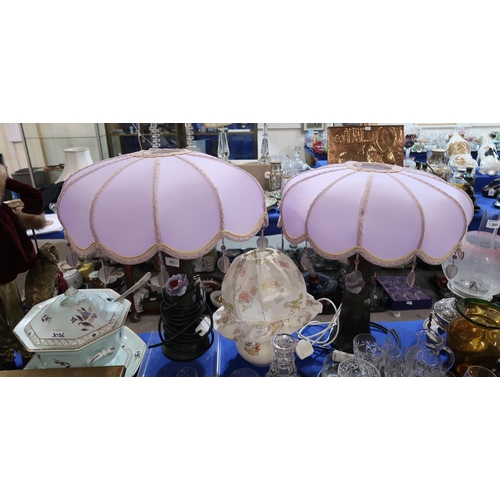 303 - A pair of amethyst glass table lamps, with painted decoration and fancy shades, together with a Bunn... 