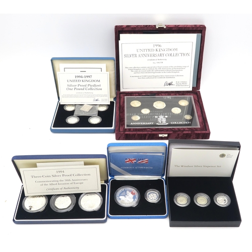 486 - Royal Mint cased silver proof coin sets, comprising a 1994-1997 piedfort one pound five-coin set, Sy... 