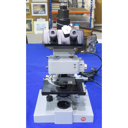 514 - A Leitz Wetzlar Ortholux biological microscope, fitted with brightfield objective lenses x10, x16, x... 