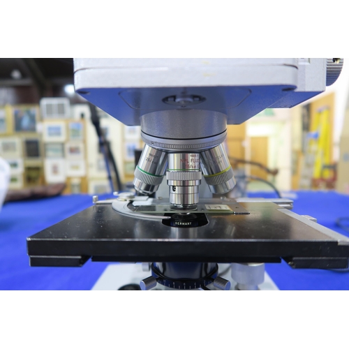 514 - A Leitz Wetzlar Ortholux biological microscope, fitted with brightfield objective lenses x10, x16, x... 