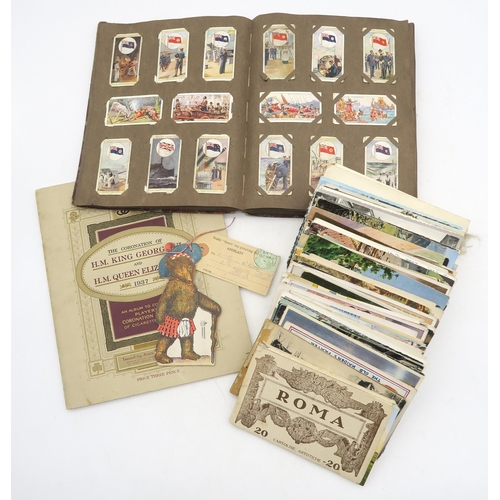 518 - A selection of 20th century postcards of mixed age, assorted cigarette cards, matchboxes and other s... 