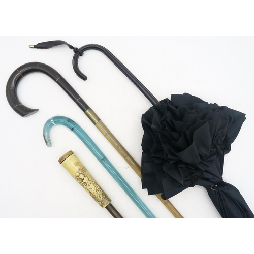 522 - A tippling stick, the screw-off handle concealing a glass flask measuring approx. 34cm in length and... 