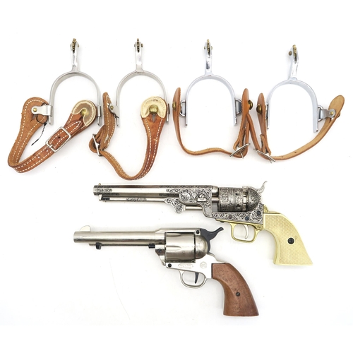 524 - Two replica American Western revolvers, each with leather gun belt/holster and two pairs of spurs