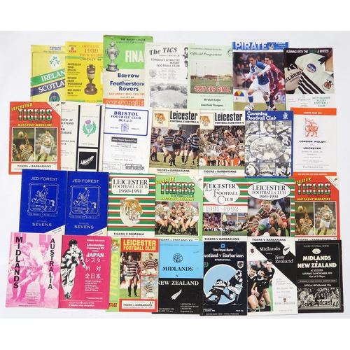 525 - A large collection of rugby and football programmes, to include Scotland vs. Ireland at Lansdowne Ro... 