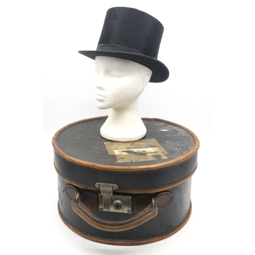 541 - A silk top hat of small size (approx. 6 7/8), contained in a travel case with label for the Marine H... 