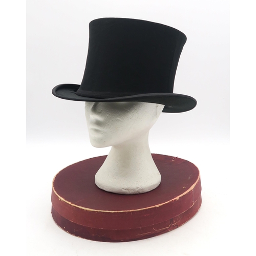 543 - A collapsible opera top hat by Victor Jay and Company, London, housed in its original card box