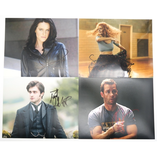 563 - A small collection of autographed colour photographs of celebrities to include Daniel Radcliffe, Ste... 