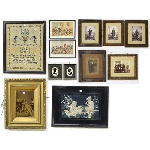 566 - A circular framed foxhunting tapestry, a George VI needlework sampler and an assortment of framed pr... 