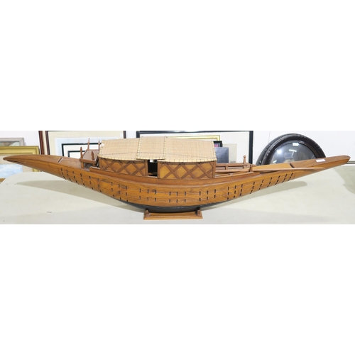 567 - A large ornamental Dhaka, with wicker-roofed cabin, measuring approx. 107cm from prow to stern