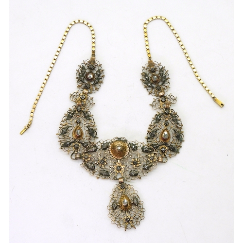 2709 - AN ANTIQUE SPANISH DIAMOND NECKLACEset with rose cut diamonds to the scroll filligree panels made in... 