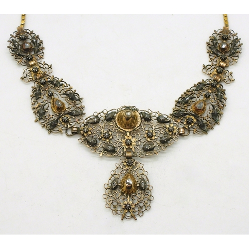 2709 - AN ANTIQUE SPANISH DIAMOND NECKLACEset with rose cut diamonds to the scroll filligree panels made in... 