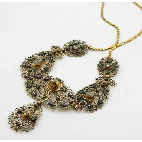 2709 - AN ANTIQUE SPANISH DIAMOND NECKLACEset with rose cut diamonds to the scroll filligree panels made in... 