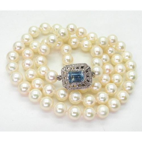 2711 - PEARLS WITH A DECORATIVE CLASPa string of good quality pearls each approx 6.3mm, overall length 48cm... 