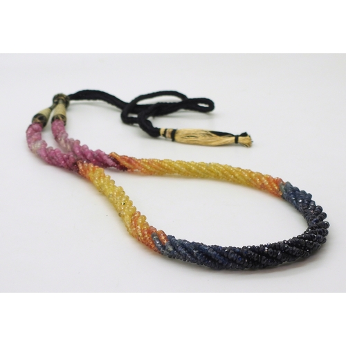 2712 - RAINBOW SAPPHIRE BEADSeach faceted bead is strung in a multi string twisted necklace with traditiona... 