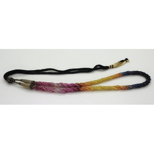 2712 - RAINBOW SAPPHIRE BEADSeach faceted bead is strung in a multi string twisted necklace with traditiona... 