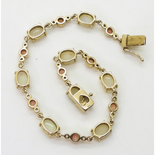 2715 - A 9CT GOLD BRACELETset with oval opals and pink and white sapphires, length 19cm, with a heart detai... 