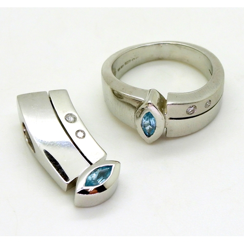 2721 - TOPAZ & DIAMOND SUITEcomprising of a 18ct white gold ring, set with a blue topaz and diamond acc... 