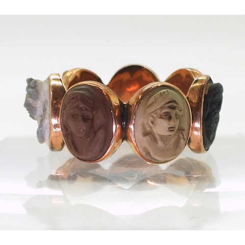 2725 - FOUR ANTIQUE JEWELSto include a rose coloured metal lava cameo ring, each of the seven panels with a... 