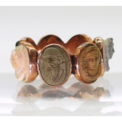 2725 - FOUR ANTIQUE JEWELSto include a rose coloured metal lava cameo ring, each of the seven panels with a... 