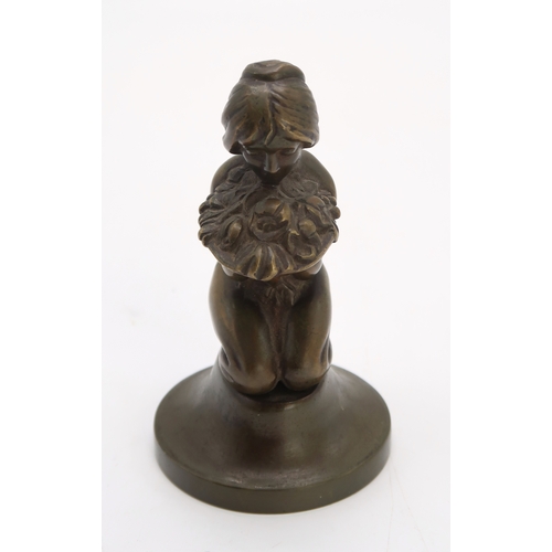 2175 - AN ART DECO BRONZE OF A GIRLmodelled kneeling holding a bowl of flowers and fruit, 14.5cm high, toge... 