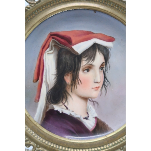 2181 - A PORCELAIN PORTRAIT PLAQUEpossibly Vienna, painted with a girl's profile, in bronze mount, 31cm dia... 
