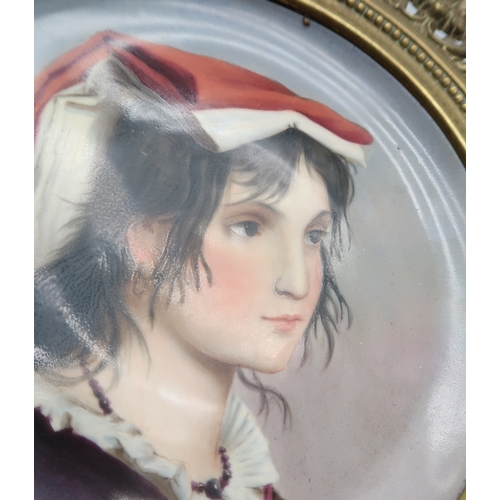 2181 - A PORCELAIN PORTRAIT PLAQUEpossibly Vienna, painted with a girl's profile, in bronze mount, 31cm dia... 