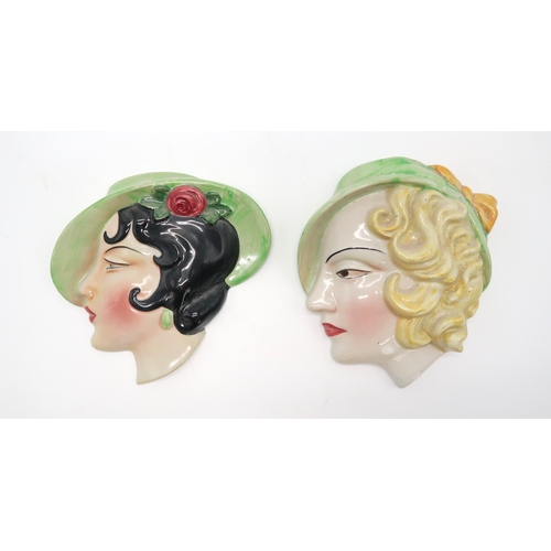 2186 - A COLLECTION OF ART DECO POTTERY WALL MASKSeach modelled as a woman's head, many by C Ltd including ... 