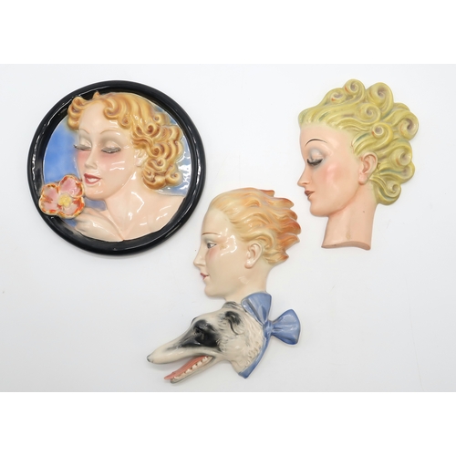 2187 - A GOEBEL WALL MASK BY AGNES RICHARDSONmodelled as a girls head with curly blonde hair, no R24, 21.5c... 